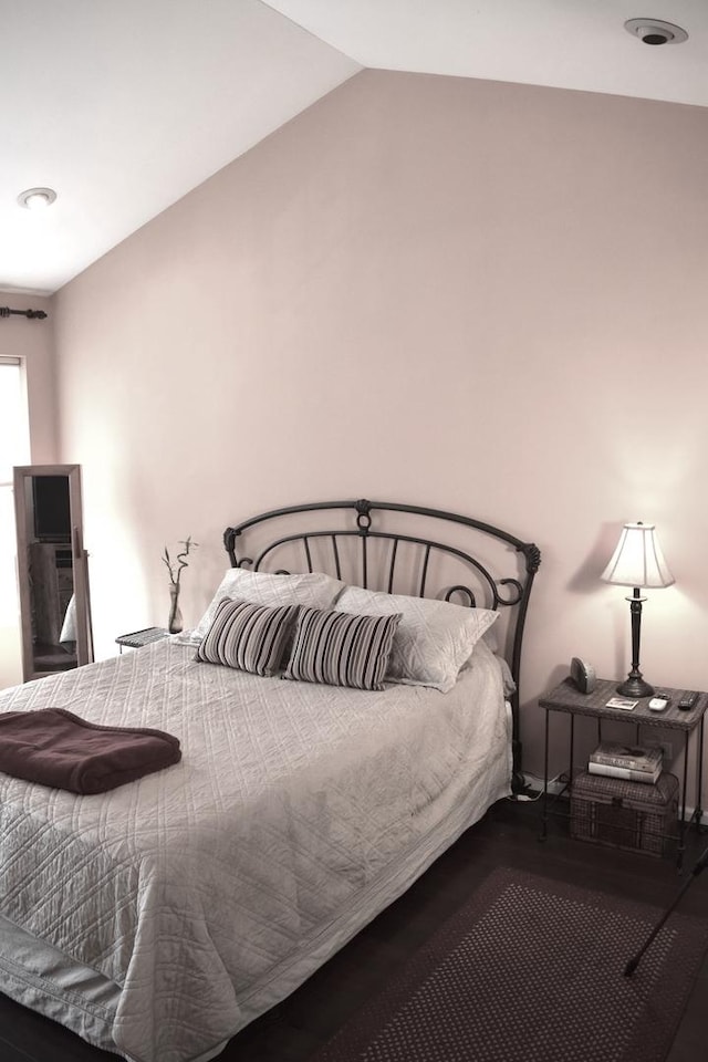 bedroom featuring lofted ceiling