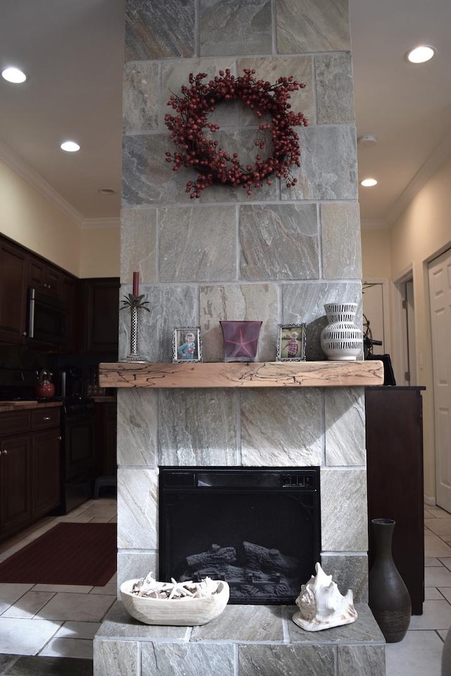 interior details with recessed lighting, ornamental molding, and a fireplace