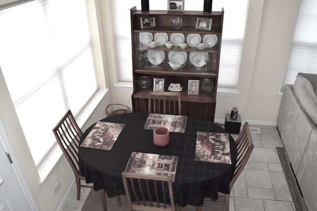 dining space featuring baseboards