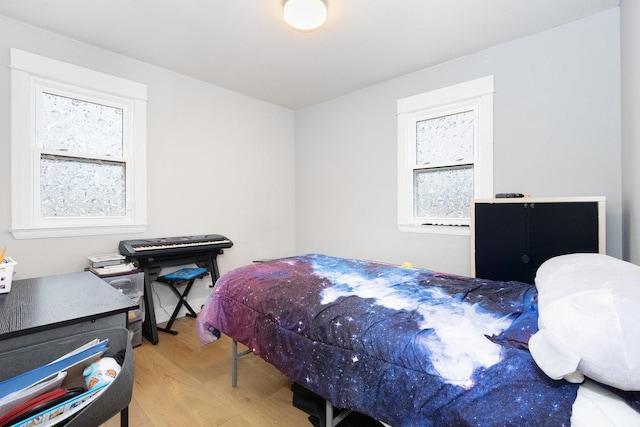 bedroom with wood finished floors