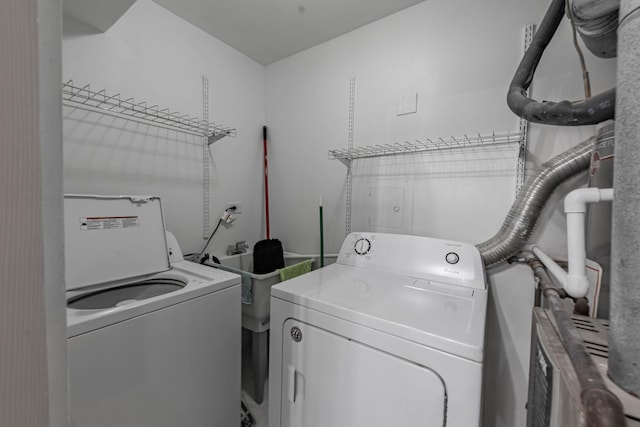 laundry room with washing machine and dryer and laundry area