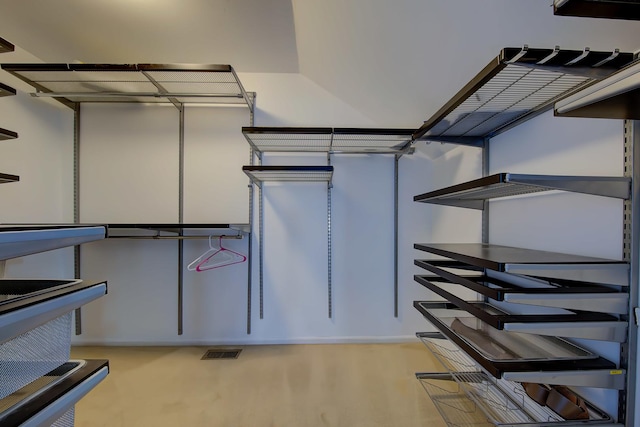 spacious closet with visible vents and wood finished floors