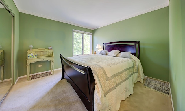 bedroom featuring baseboards, ornamental molding, and carpet flooring