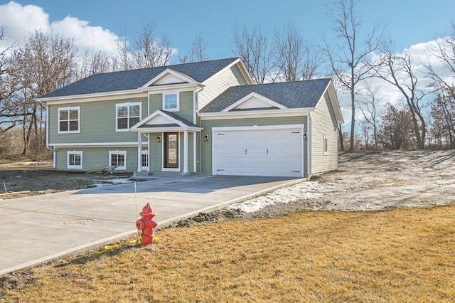 view of front of house featuring a garage and concrete driveway