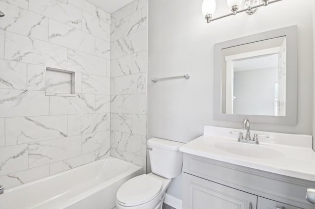 bathroom featuring toilet, shower / bath combination, and vanity