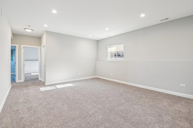 empty room with baseboards, carpet, visible vents, and recessed lighting