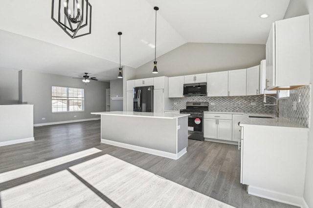 kitchen with white cabinets, a ceiling fan, stainless steel appliances, and a sink