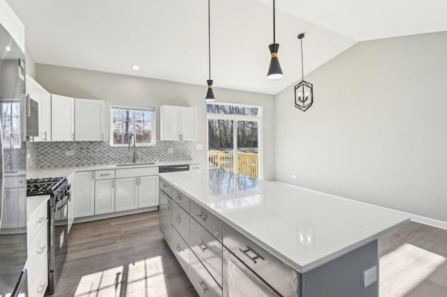 kitchen with plenty of natural light, a sink, and black gas range oven