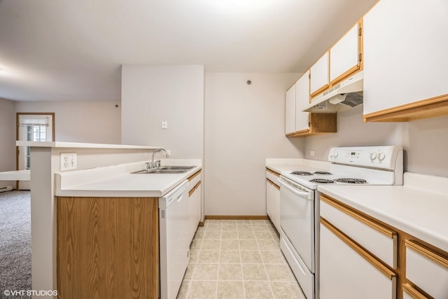 kitchen with white appliances, light countertops, a sink, and under cabinet range hood