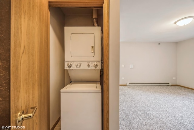 laundry area featuring carpet floors, stacked washer / drying machine, baseboard heating, laundry area, and baseboards