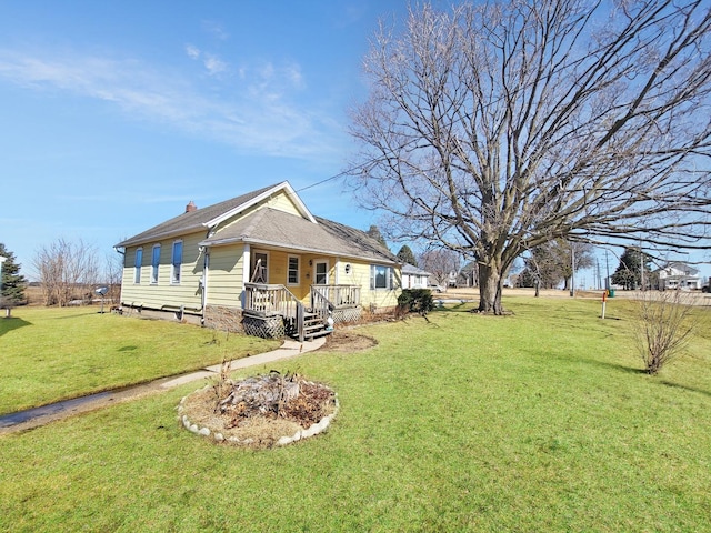 exterior space featuring a chimney and a front yard