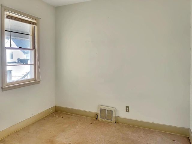 spare room with visible vents and baseboards