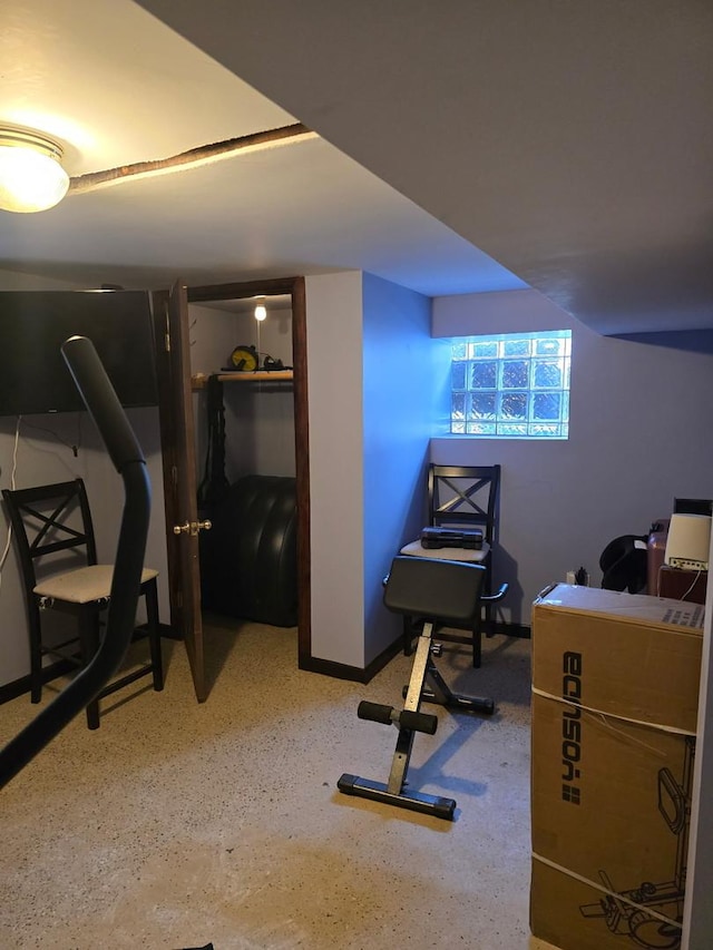 exercise room with baseboards