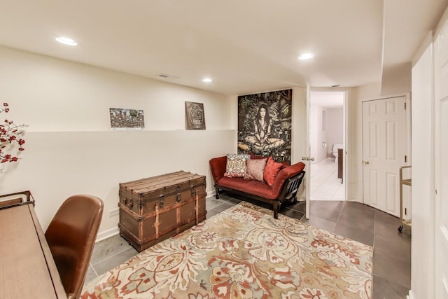 sitting room with recessed lighting, visible vents, and tile patterned floors