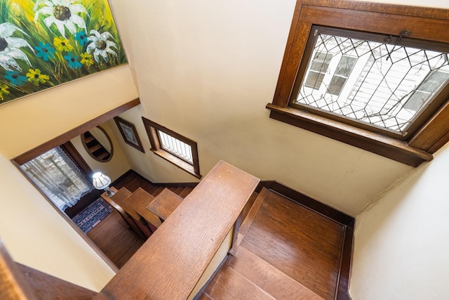 stairway featuring a high ceiling