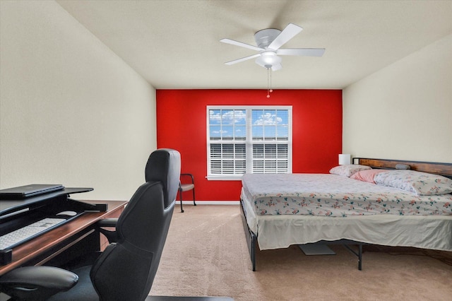 bedroom featuring ceiling fan, baseboards, and light carpet