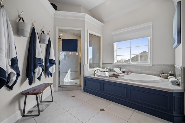 full bathroom featuring a garden tub, ornamental molding, a stall shower, and tile patterned flooring