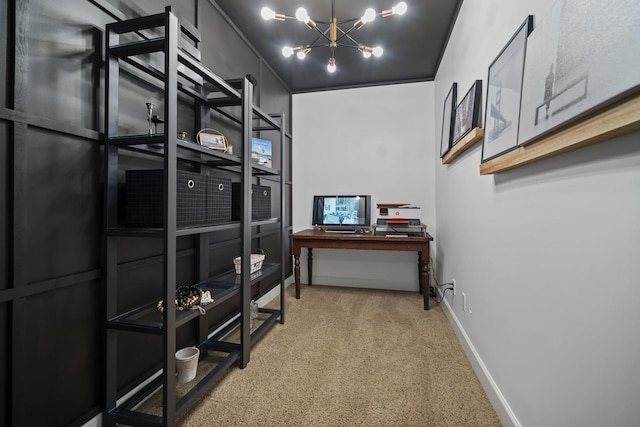 interior space featuring a chandelier and baseboards