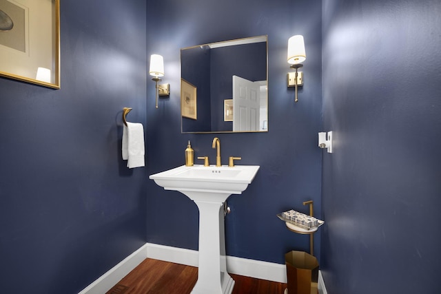 bathroom featuring baseboards and wood finished floors