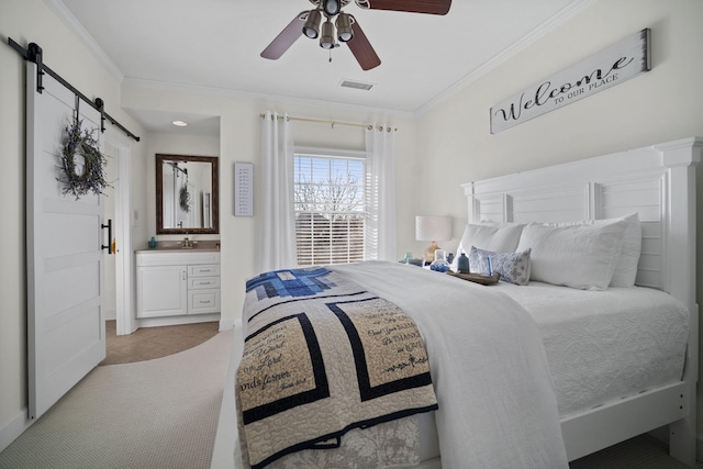 bedroom with ornamental molding, light tile patterned flooring, visible vents, and a barn door