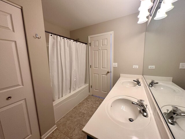 full bath with double vanity and a sink