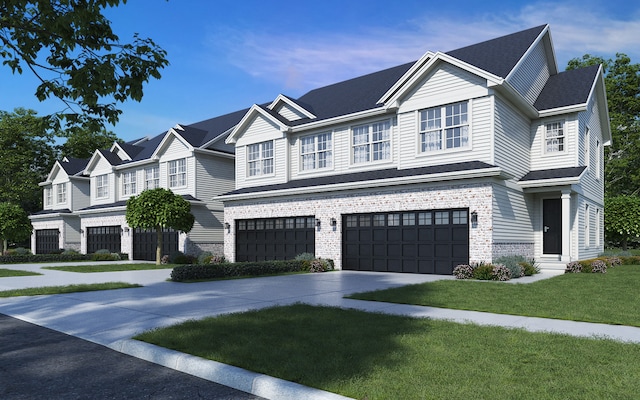 view of front of home featuring concrete driveway, a front lawn, and an attached garage