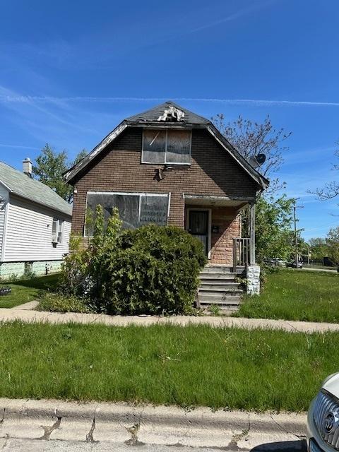 304 W 104th Pl, Chicago, IL 60628 - bungalow-style home with brick siding