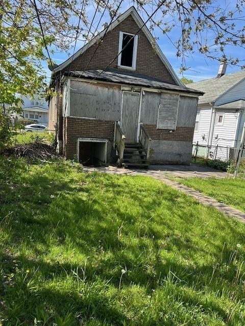 304 W 104th Pl, Chicago, IL 60628 - rear view of property with brick siding and entry steps