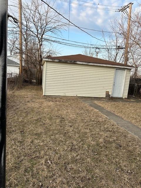 garage with fence