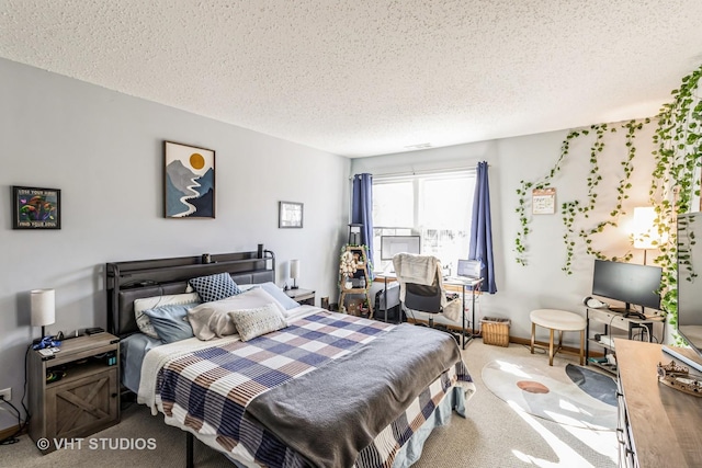 carpeted bedroom featuring a textured ceiling and baseboards