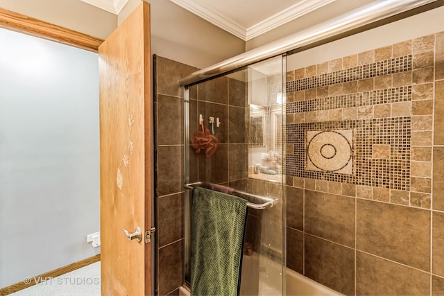 full bathroom featuring bath / shower combo with glass door and crown molding