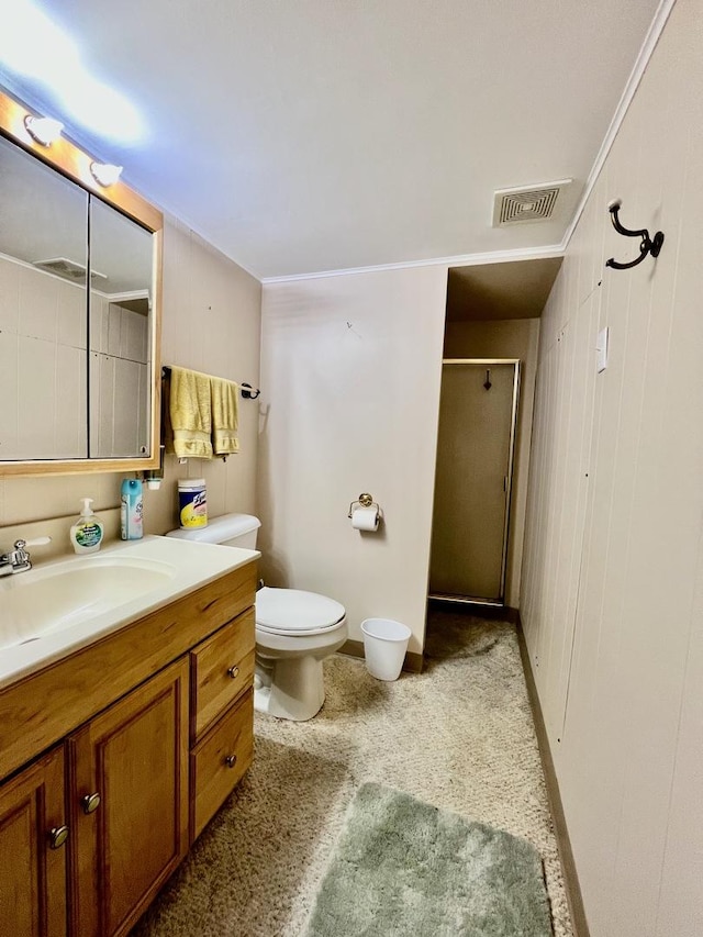 bathroom featuring a stall shower, visible vents, vanity, and toilet