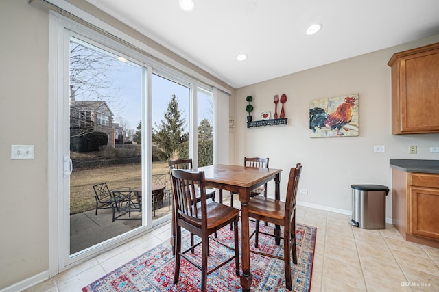 dining room featuring recessed lighting, light tile patterned flooring, and baseboards