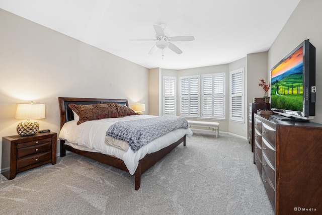 bedroom with carpet floors, a ceiling fan, and baseboards