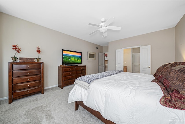 bedroom featuring a ceiling fan, light colored carpet, and baseboards