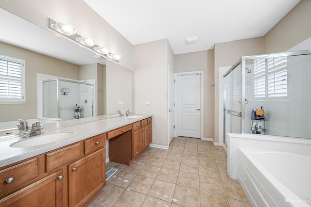 bathroom with double vanity, a sink, a shower stall, tile patterned flooring, and a bath