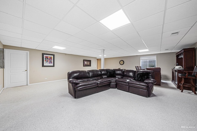 living area featuring a paneled ceiling, carpet, visible vents, and baseboards