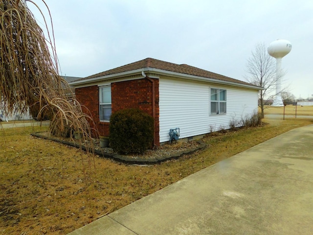 view of home's exterior with brick siding