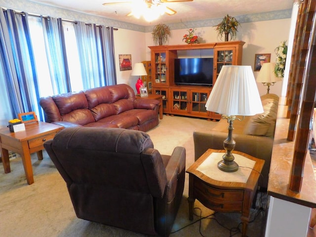 living room with carpet flooring and a ceiling fan