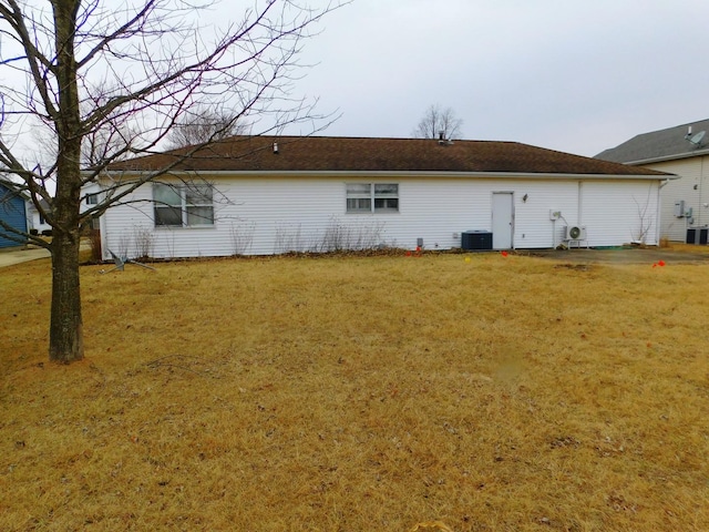 view of property exterior featuring a yard and central air condition unit