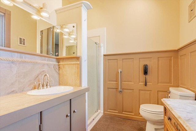 full bath with visible vents, vanity, a shower stall, and toilet