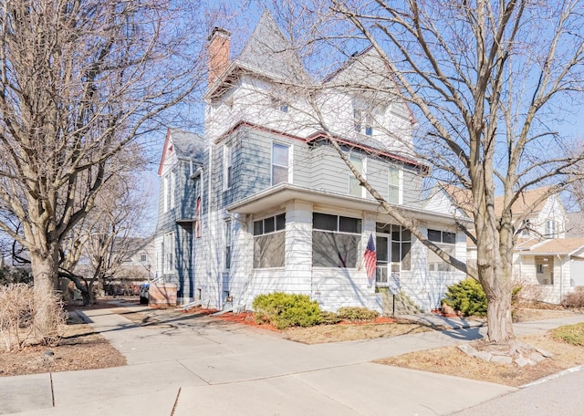 victorian-style house with a sunroom