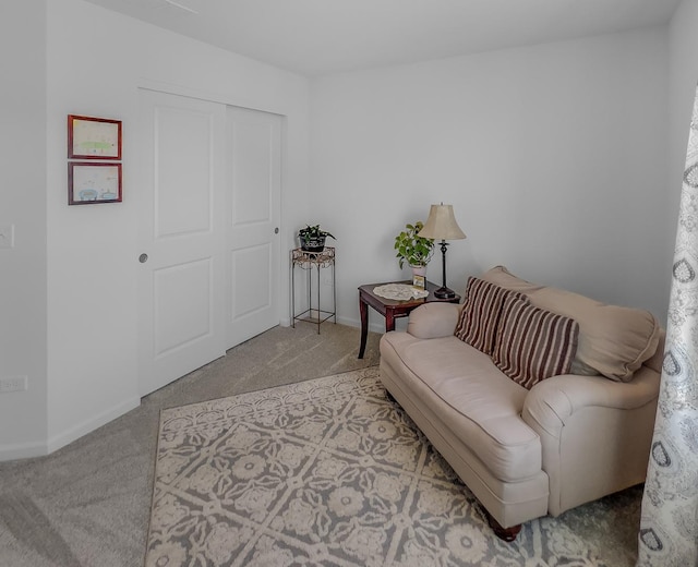 sitting room with carpet and baseboards