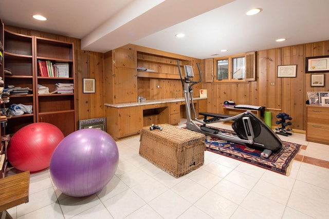 exercise area featuring recessed lighting and wooden walls