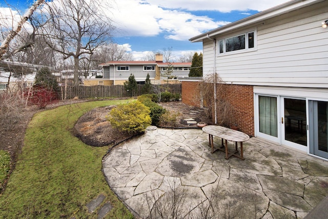 view of patio / terrace featuring fence