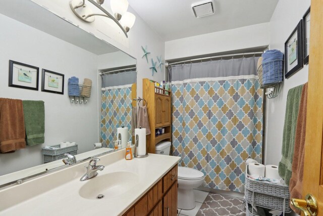 5326 S Nagle Ave, Chicago, IL 60638 - bathroom with curtained shower, vanity, toilet, and tile patterned floors