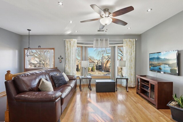 5326 S Nagle Ave, Chicago, IL 60638 - living room with recessed lighting, visible vents, light wood-style flooring, ceiling fan, and baseboards