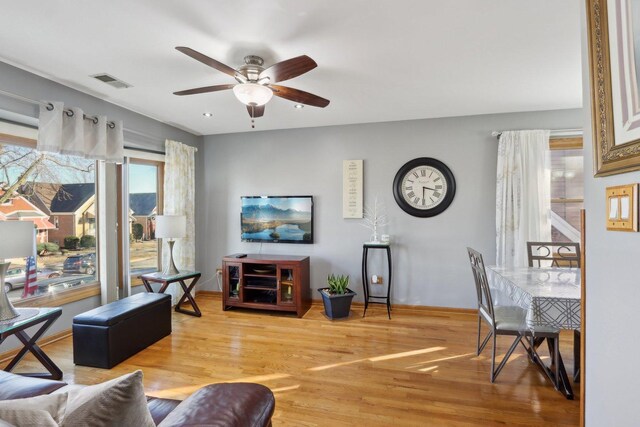 5326 S Nagle Ave, Chicago, IL 60638 - living room with a ceiling fan, visible vents, baseboards, and wood finished floors