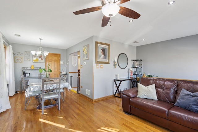 5326 S Nagle Ave, Chicago, IL 60638 - living area featuring recessed lighting, baseboards, visible vents, light wood-type flooring, and ceiling fan with notable chandelier