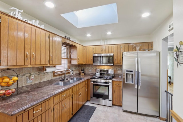 5326 S Nagle Ave, Chicago, IL 60638 - kitchen with tasteful backsplash, appliances with stainless steel finishes, a sink, and light tile patterned flooring